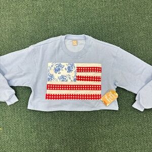 Messy Bun Light Blue Sweatshirt with Flag Design